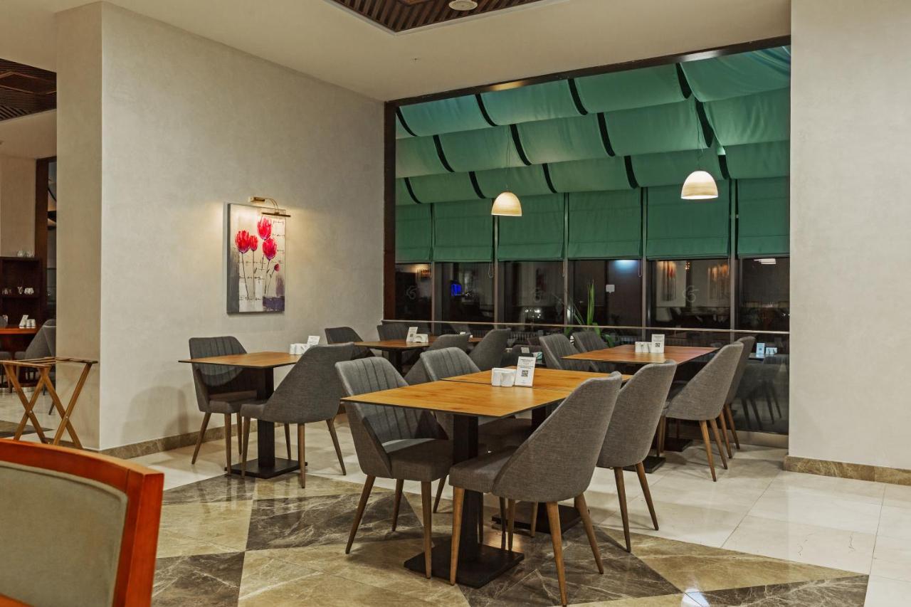 Dedeman Oskemen Tavros Hotel Ust-Kamenogorsk Exterior photo The restaurant