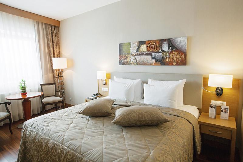 Dedeman Oskemen Tavros Hotel Ust-Kamenogorsk Exterior photo A room at the hotel