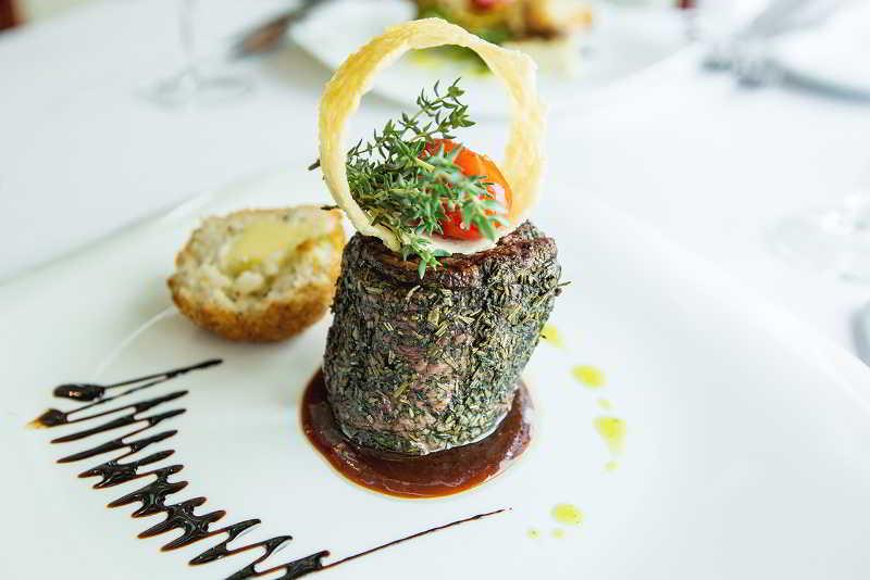 Dedeman Oskemen Tavros Hotel Ust-Kamenogorsk Exterior photo A steak au poivre prepared in a restaurant