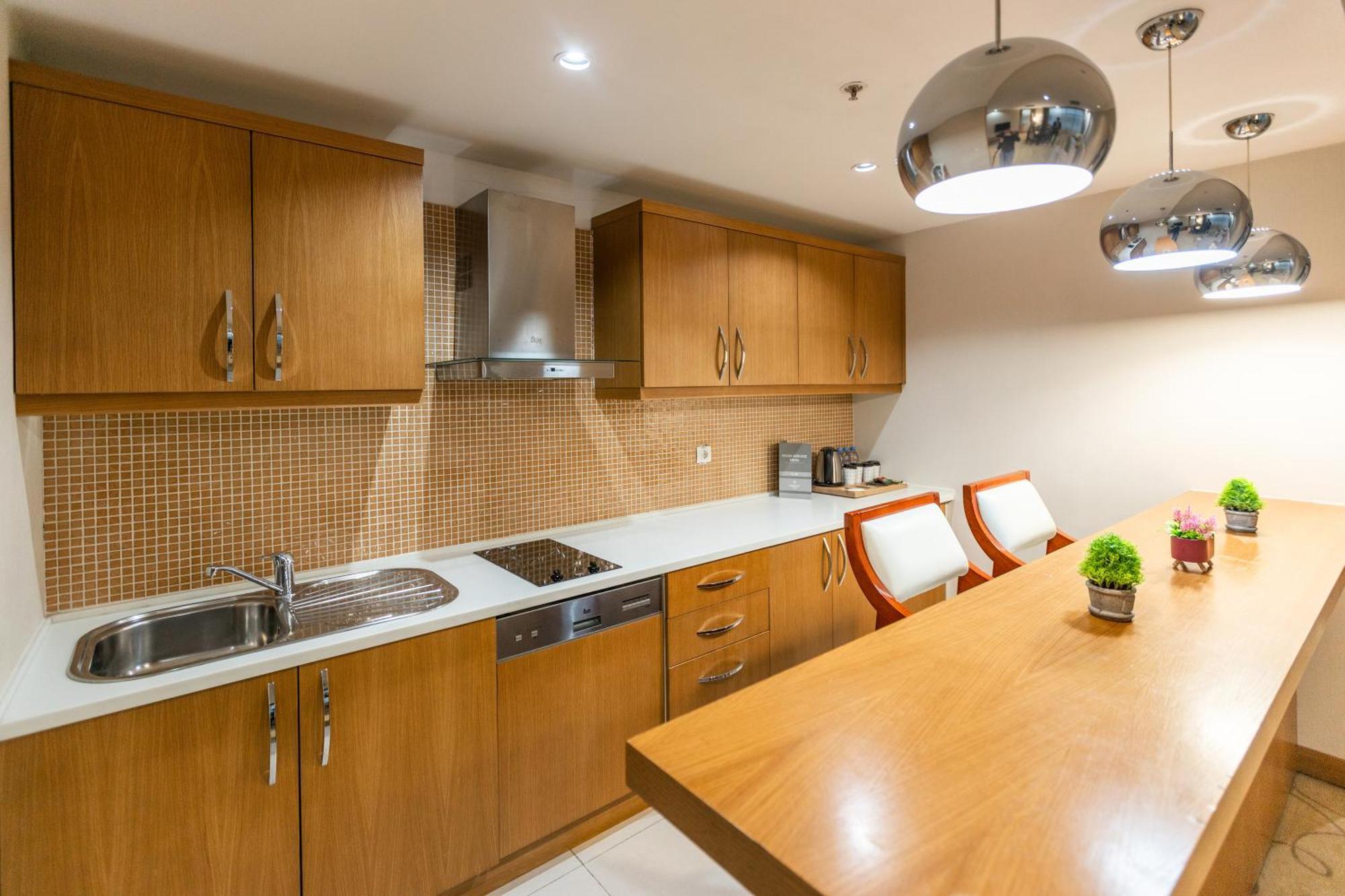 Dedeman Oskemen Tavros Hotel Ust-Kamenogorsk Exterior photo A modern kitchen