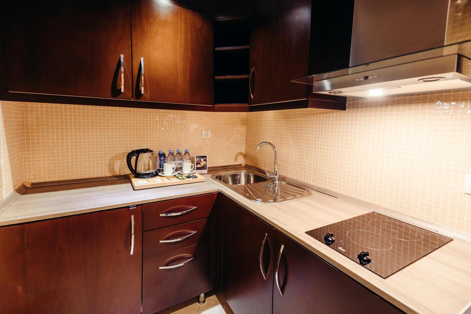 Dedeman Oskemen Tavros Hotel Ust-Kamenogorsk Room photo A modern kitchen
