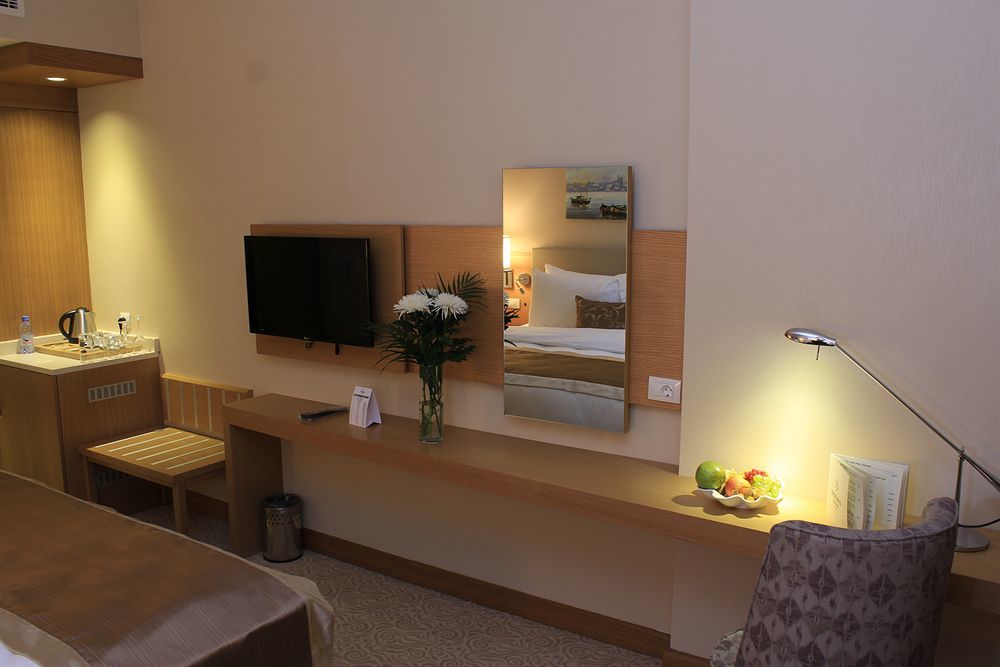 Dedeman Oskemen Tavros Hotel Ust-Kamenogorsk Exterior photo A room at the hotel